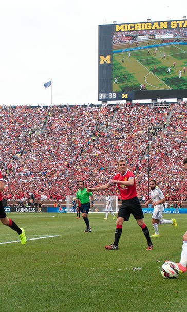 Record soccer crowd turns Michigan Stadium red